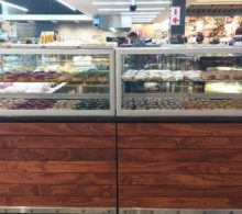 Glass bakery display unit of donuts